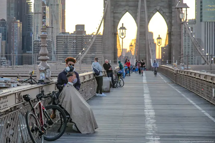 A photo of people on the Brooklyn Bridge